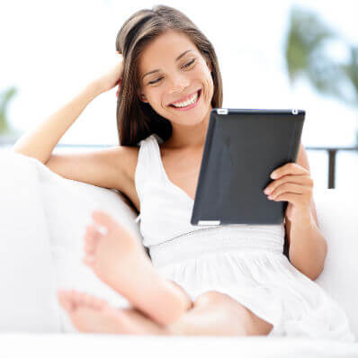a woman is smiling when reading 7 steps to wealth blog