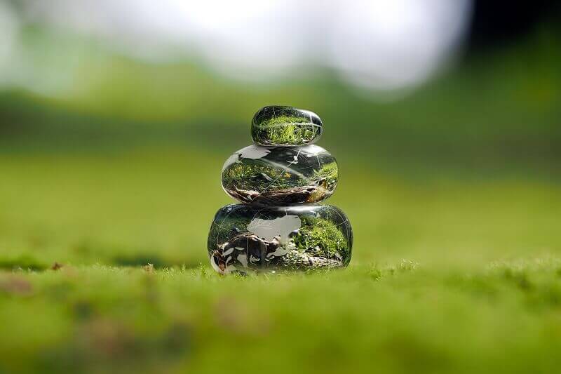 Transparent stones on a green moss presenting the power of creative thinking